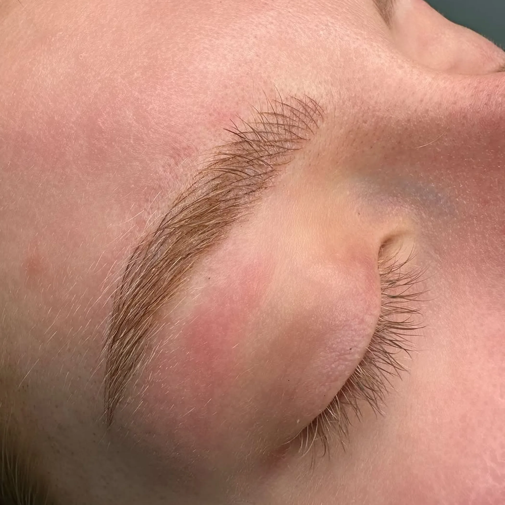 eyebrow feathering technique close-up