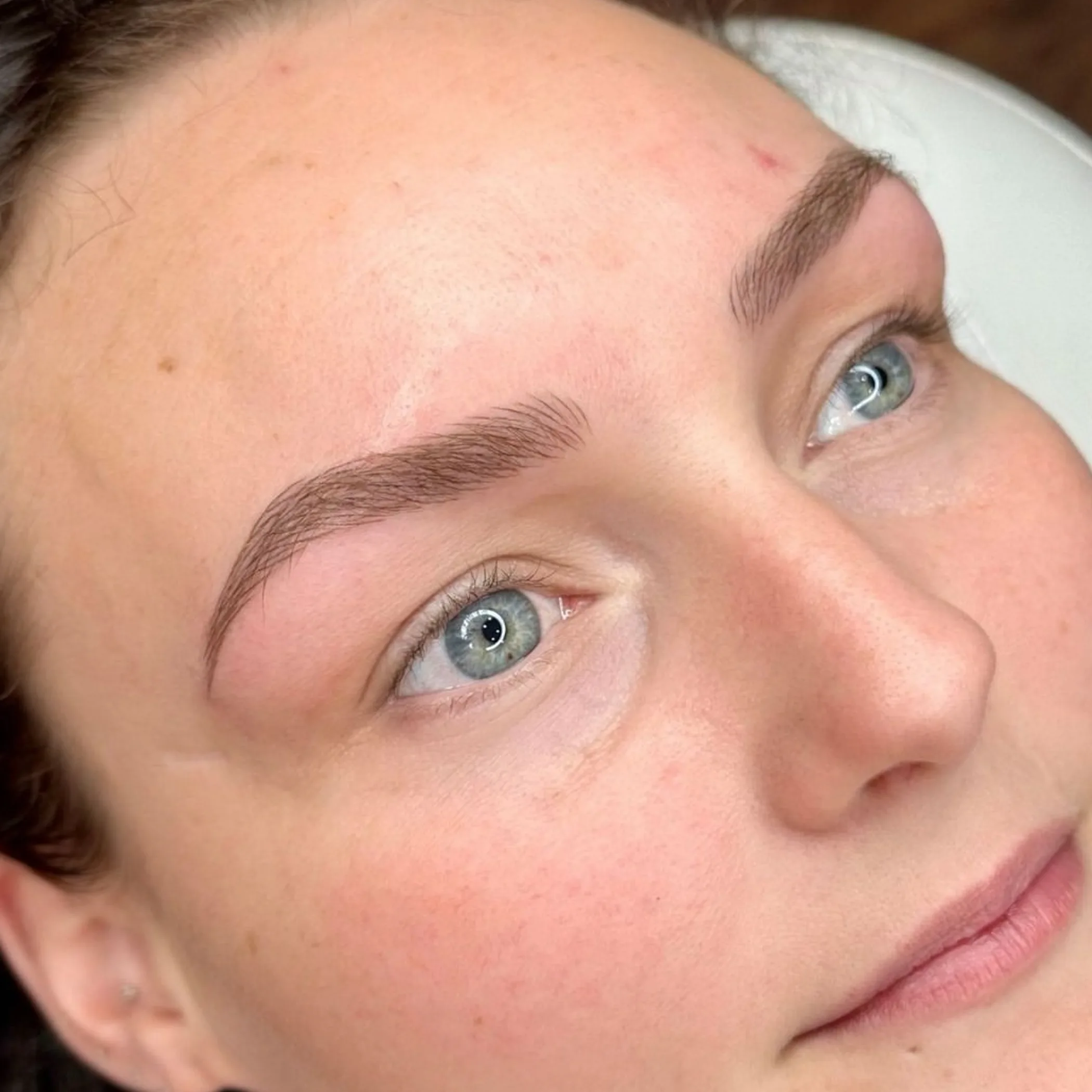 eyebrow feathering technique close-up